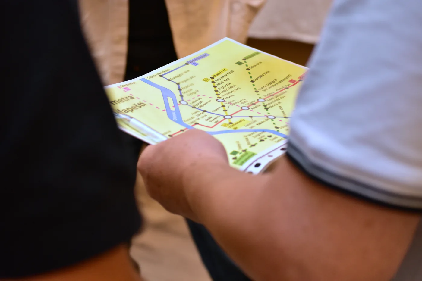 A Budapest metro map in a participant's hands
